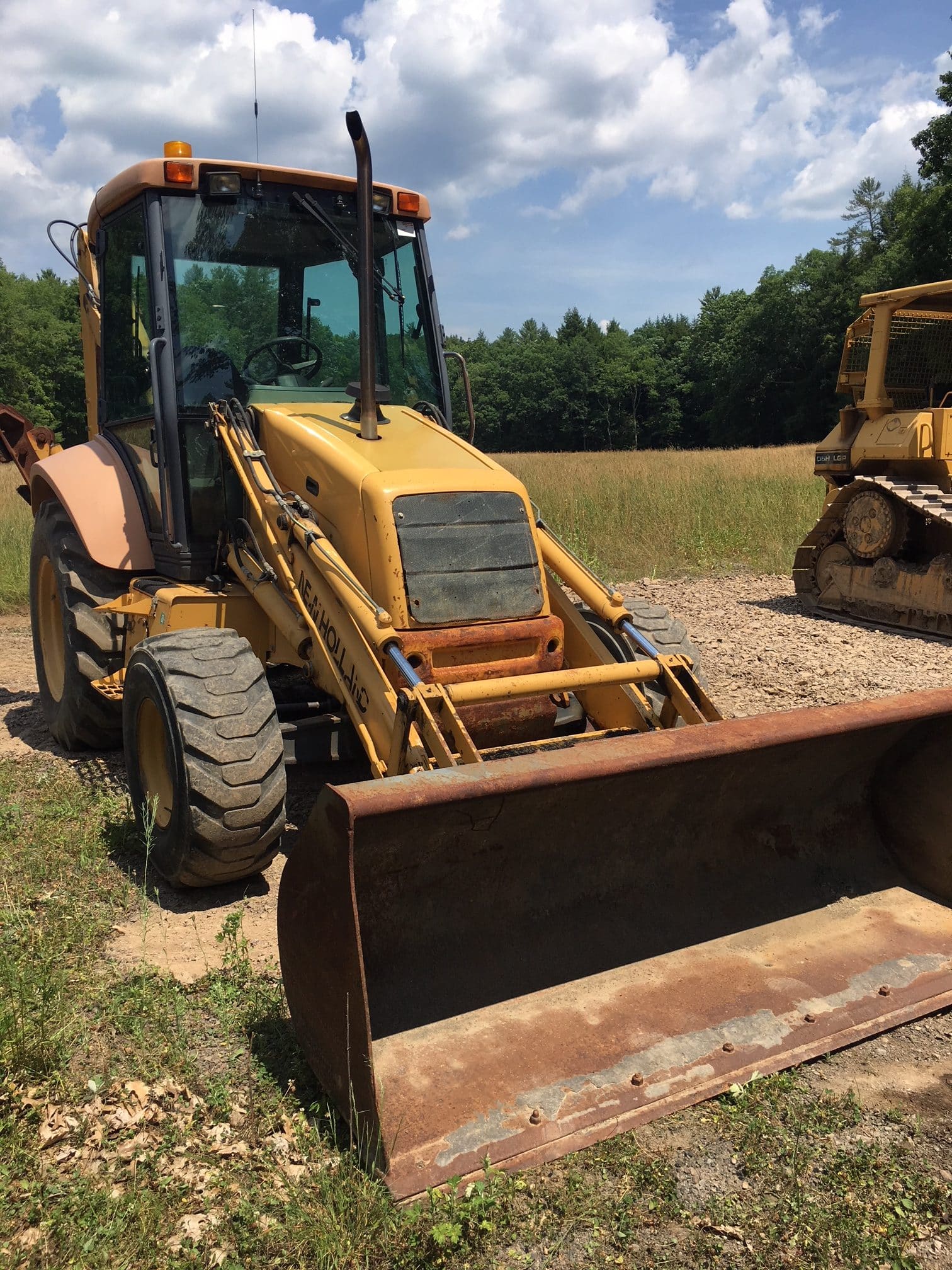 New Holland 4WD 555E Extendahoe backhoe 20'000 SOLD! United Exchange USA