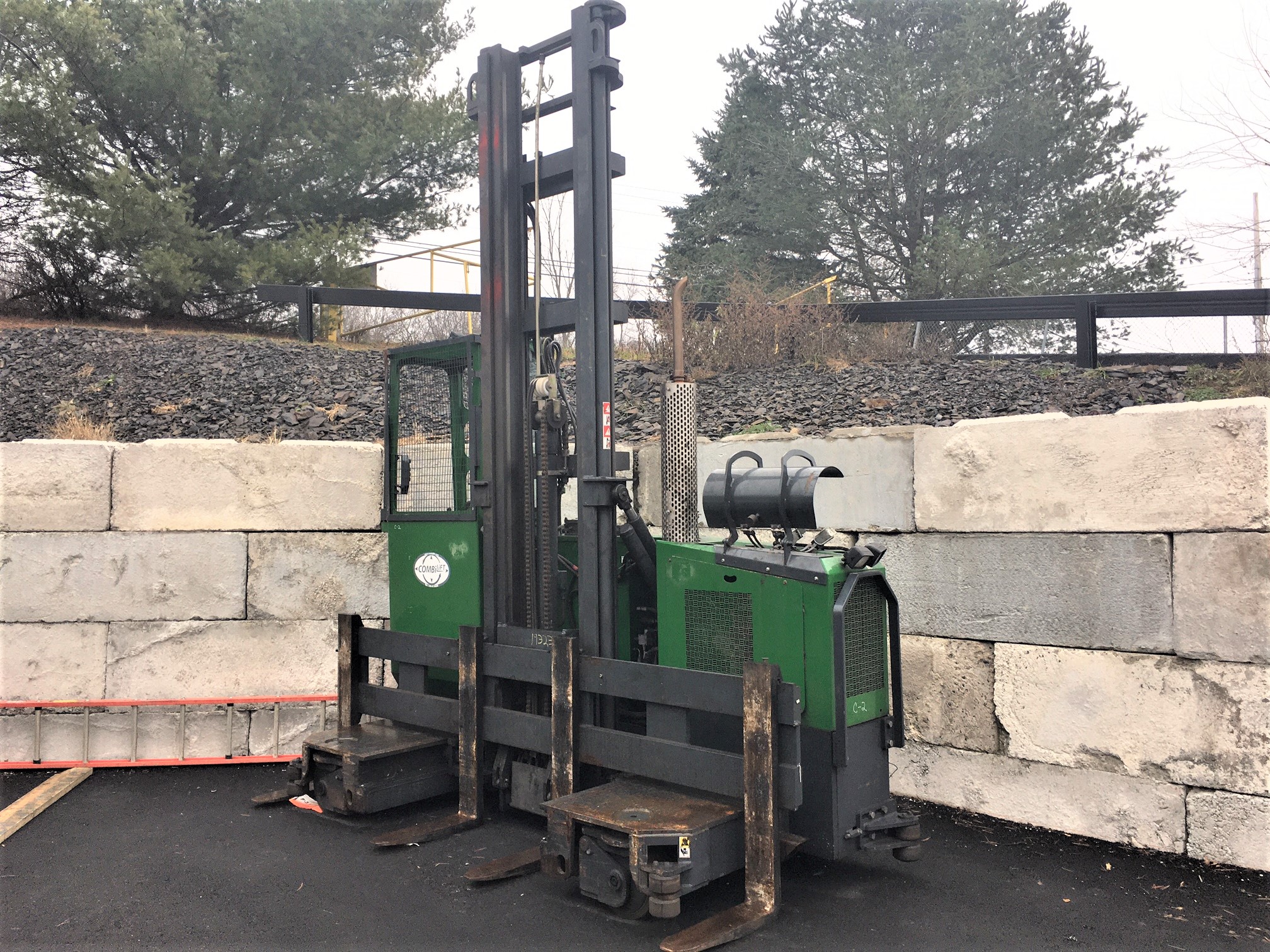 Combilift Bi Directional Forklift. 2013 model C10000GT with 2674 hours. 10'000 lb. for wheel drive side loader forklift. LPG engine with 159 inch two stage mast, 154 inch wide carriage and 4 forks. 17'200 lb. unladen weight.