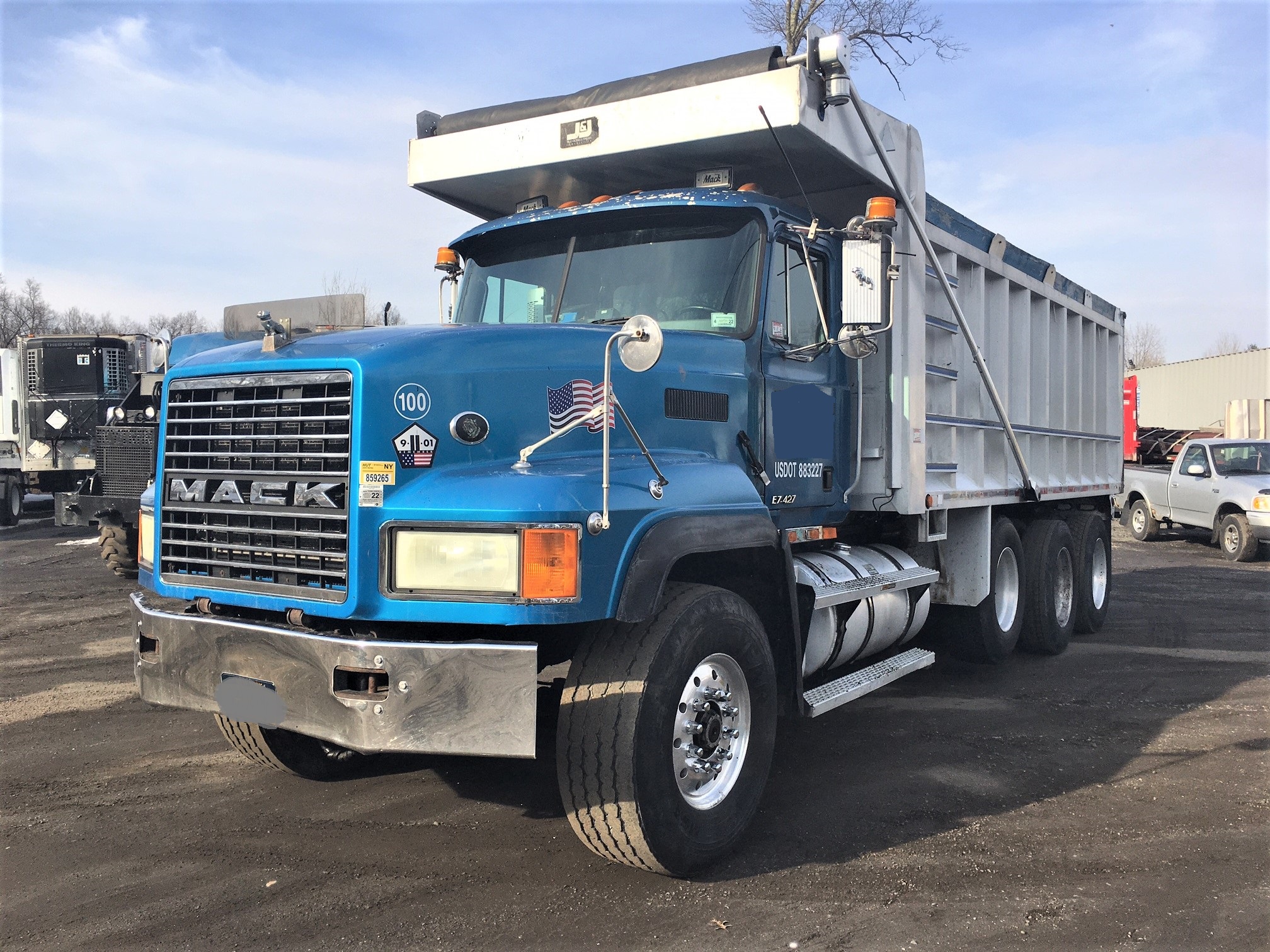 Mack Tri-Axle Dump Truck. 1998 CL-713 model truck with an E7-427 V Mac Engine driven 440'000 miles. 8 speed low/low Eaton Fuller transmission. Straight tri-axle "non steerable" 46'000 lb. newer rears, yolks and U joints. New radiator. Air ride suspension. Comfortable driving and riding dump truck. J&J 24 yard aluminum side steel floor dump box measuring 19 1/2 feet long by 5 feet 8 inches high. Great truck for hauling coal, mulch, blacktop, dirt, rock or gravel material.