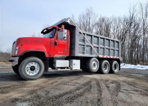 International Tri Axle Dump Truck. 2006 Paystar with 235368 miles. ISX Cummins 500 horsepower diesel engine with a three stage engine brake. 18 speed Eaton Fuller transmission with double locking rears. 20k lb. fronts, 20k lb. steerable lift axle and 46k lb. rears. All new in rear Chalmers suspension package for supper comfortable control and ride. 242 inch wheelbase. 17.5 foot long by 5 foot high steel dump box sandblasted and repainted outside. Interior Eagle package design with power windows, power locks, cruise control, heated mirrors, heat/AC, AM/FM CD player and air ride drivers seat.