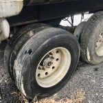 Spring suspension end dump trailer for sale.